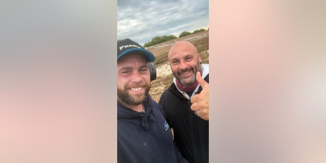 Matt Goldsmith (left) is pictured with Glen Darrell  (right)after Goldsmith found Darrell's two missing rings.