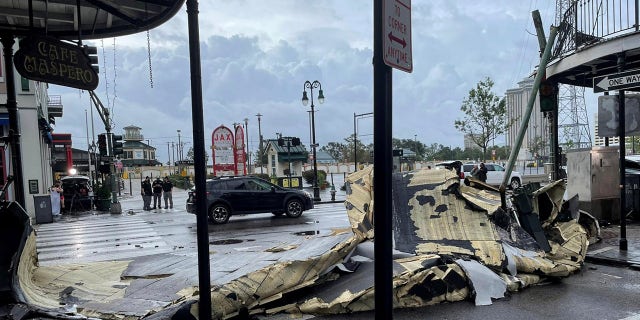 The roof of a building next to Jax Brewery lies on the ground after it was blown off due to strong winds from Hurricane Ida in New Orleans, Louisiana, Aug. 30, 2021.