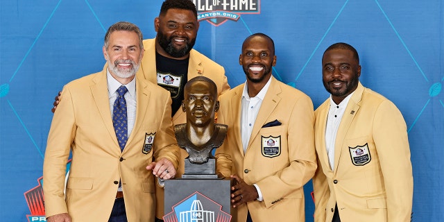 Kurt Warner, Orlando Pace, Isaac Bruce and Marshall Faulk pose during the induction ceremony at the Pro Football Hall of Fame on Aug. 7, 2021 in Canton, Ohio.