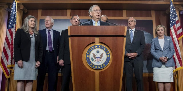 Senate Minority Leader Mitch McConnell, R-Ky., alongside other senate Republicans, speaks to members of the media on Capitol Hill in Washington, about the impact of proposed tax increases on the middle class on Wednesday, Aug. 4, 2021. McConnell and Senate Republicans are united in their opposition to Democrats $3.5 trillion budget plan they've dubbed a "reckless tax and spending spree."