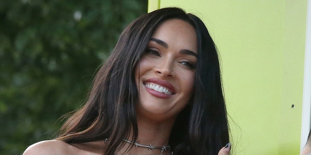 Megan Fox shared snapshots of herself shopping in a revealing neon green bodysuit on Monday.  