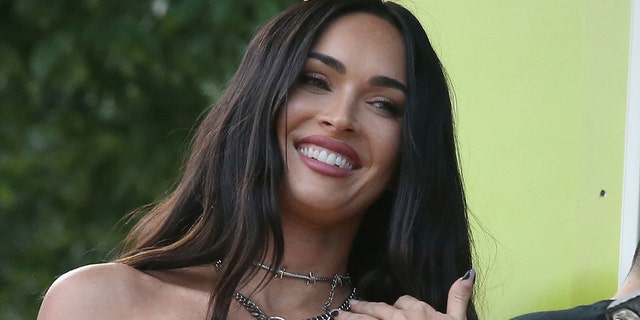 Megan Fox shared snapshots of herself shopping in a revealing neon green bodysuit on Monday.  