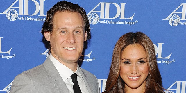 Trevor Engelson and Meghan Markle.