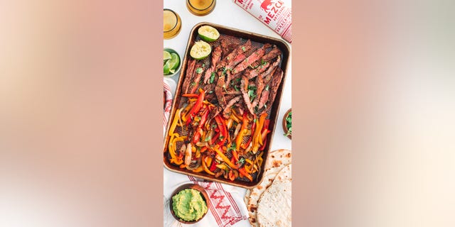 The combination of strips of steak, colorful bell peppers, guacamole and lime wedges are the perfect way to celebrate National Fajita Day on Wednesday, Aug. 18.