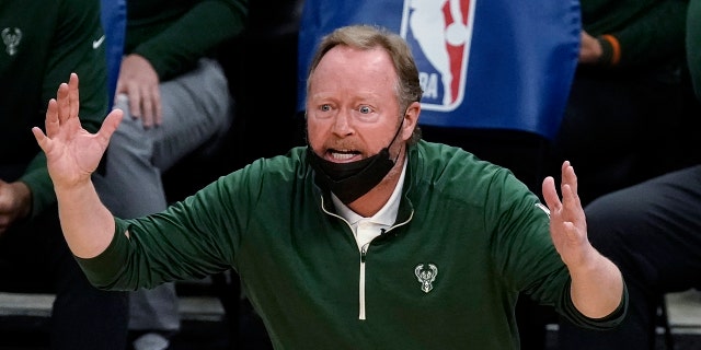 Milwaukee Bucks coach Mike Budenholzer reacts to a call during a February 2021 game against the Toronto Raptors in Milwaukee.