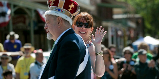 In this May 26, 2012 file photo, festival emperor Robert Ringwald of the Fulton Street Jazz Band rides with his daughter, actress Molly Ringwald, in the Sacramento Music Festival parade in Old Sacramento at Sacramento, Calif. Robert Ringwald, the pianist who has played and promoted jazz in California for more than half a century, died on Tuesday August 3, 2021, according to his daughter.  He was 80 years old.  