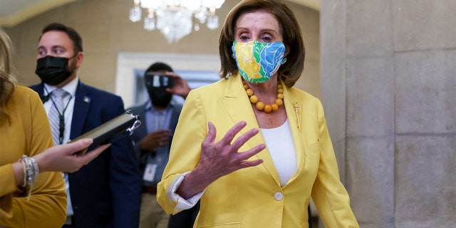 Speaker of the House Nancy Pelosi, D-Calif., leaves the chamber after urging advancement of the John Lewis Voting Rights Advancement Act, named for the late Georgia congressman who made the issue a defining one of his career, at the Capitol in Washington, Tuesday, Aug. 24, 2021. (AP Photo/J. Scott Applewhite)