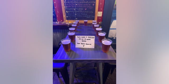 Another table, spotted at Okies Yardhouse in Kemah, Texas, showed 13 frothy beers set out along with a handwritten note Saturday night.