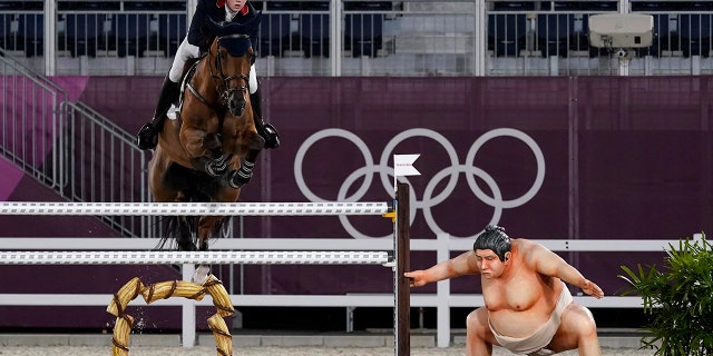 Britain's Harry Charles, riding Romeo 88, competes during the equestrian jumping individual qualifying at Equestrian Park in Tokyo at the 2020 Summer Olympics, Tuesday, Aug. 3, 2021, in Tokyo, Japan. (AP Photo/Carolyn Kaster)