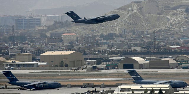 A US Air Force aircraft takes off from the airport in Kabul on August 30, 2021. 