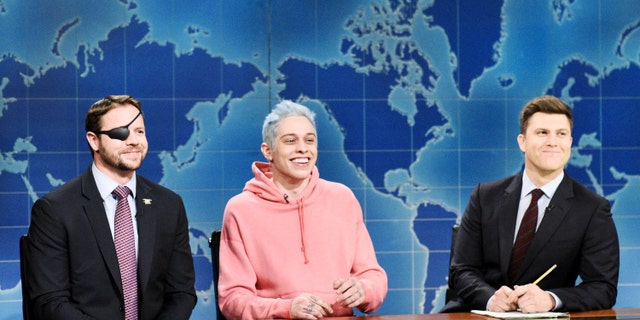 Dan Crenshaw made an appearance on ‘SNL’ after Pete Davidson mocked him for wearing an eye-patch. The comedian later claimed he was ‘forced’ to apologize for his joke.