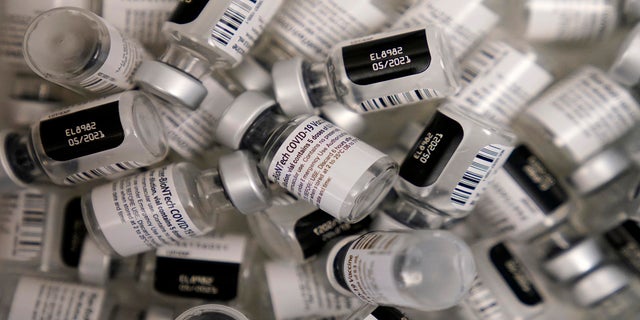 Used vials of the Pfizer-BioNTech COVID-19 vaccine lay empty at a vaccination center at the University of Nevada in Las Vegas in January. The U.S. government announced on Aug. 11, 2021, it will deliver Pfizer vaccines to the Caribbean. (AP)