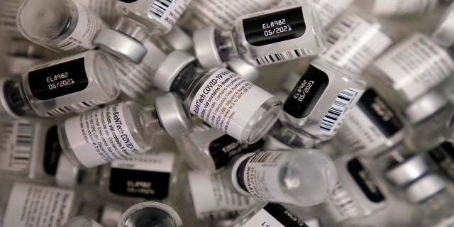 Used vials of the Pfizer-BioNTech COVID-19 vaccine lay empty at a vaccination center at the University of Nevada in Las Vegas in January. The U.S. government announced on Aug. 11, 2021, it will deliver Pfizer vaccines to the Caribbean. (AP)