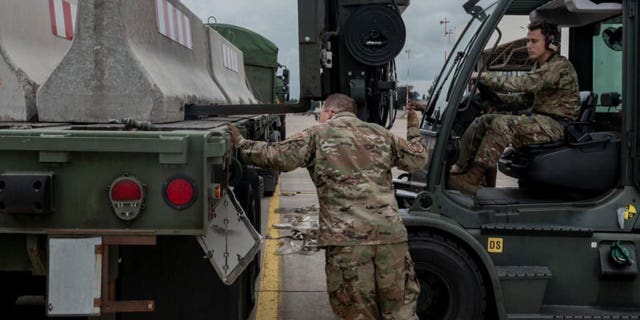 U.S. military personnel and volunteers make preparations for arriving evacuees at Ramstein Air Base in Germany. (Ramstein Air Base photo)