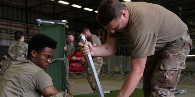 U.S. military personnel and volunteers make preparations for arriving evacuees at Ramstein Air Base in Germany. (Ramstein Air Base photo)