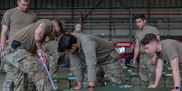 U.S. military personnel and volunteers make preparations for arriving evacuees at Ramstein Air Base in Germany. (Ramstein Air Base photo)