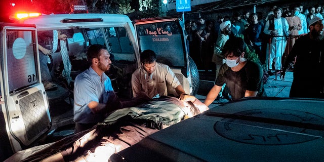 Victims of Thursday's attack at the Kabul airport in Afghanistan arrive at the Emergency Surgical Center for War Victims. (Reuters)