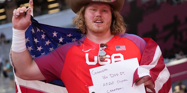 Ryan Crouser, of United States, celebrates after winning the final of the men's shot put at the 2020 Summer Olympics, Thursday, Aug. 5, 2021, in Tokyo. (AP Photo/Matthias Schrader)
