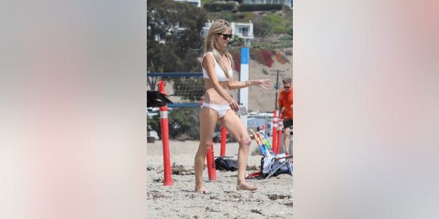 Christina Haack enjoys a beach day with her new beau Josh Hall and five-year-old son.
