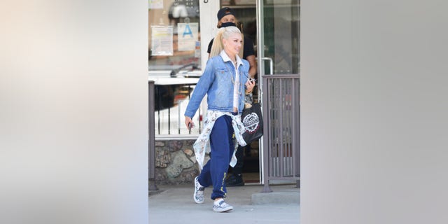 Gwen Stefani rocks custom Blake Shelton Vans in Los Angeles.