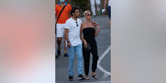 Sandra Lee and Ben Youcef take a walk during their holidays in Ramatuelle, Southeastern France on August 8, 2021.