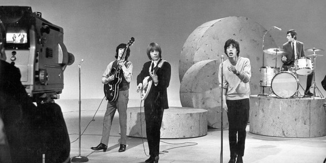 The Rolling Stones perform on the ‘Ed Sullivan Show’ on October 25, 1964 in New York City, New York. From L-R: Bill Wyman, Brian Jones, Mick Jagger, Charlie Watts, Keith Richards.