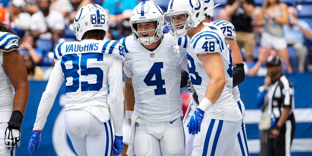 Indianapolis Colts quarterback Sam Ehlinger (4) celebrates after a two-point conversion against the Carolina Panthers during the second half of an NFL football game in Indianapolis, Sunday, Aug. 15, 2021. (AP Photo/AJ Mast)