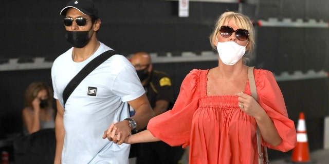 Sandra Lee of 'Semi-Homemade' arrives in Los Angeles with her fiance Ben Youcef after an international getaway that came amid the fallout from Andrew Cuomo's resignation as New York governor.