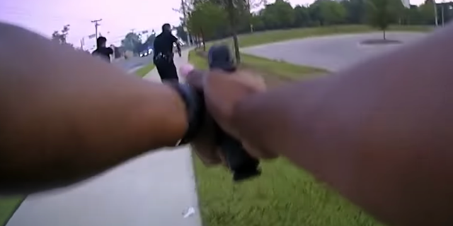 Officer Cherell Kinchloe's actions "in firing two shots given the vantage point represented by her video" are under review, police said.