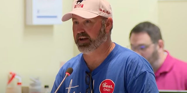 A man speaks at a Loudoun County School Board meeting on Aug. 10.