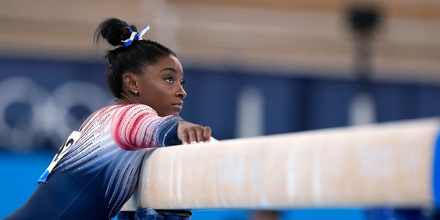 Simone Biles, of the United States, preparers to perform on the balance beam during the artistic gymnastics women's apparatus final at the 2020 Summer Olympics, Tuesday, Aug. 3, 2021, in Tokyo, Japan.