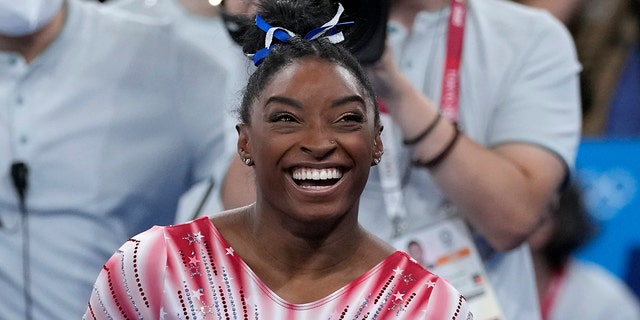 Simone Biles, of the United States, after performing on the balance beam during the artistic gymnastics women's apparatus final at the 2020 Summer Olympics, Tuesday, Aug. 3, 2021, in Tokyo, Japan. 