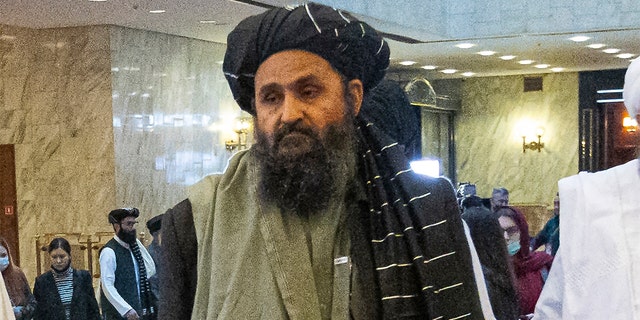 In this March 18, 2021, file photo, Taliban co-founder Mullah Abdul Ghani Baradar, arrives with other members of the Taliban delegation for an international peace conference in Moscow, Russia.