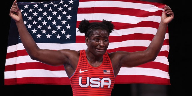 USA's Tamyra Marianna Stock Mensah celebrates her gold medal victory against Nigeria's Blessing Oborududu in their women's freestyle 68kg wrestling final match during the Tokyo 2020 Olympic Games at the Makuhari Messe in Tokyo on August 3, 2021. (Photo by Jack GUEZ / AFP) (Photo by JACK GUEZ/AFP via Getty Images)