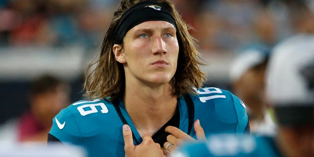 Jacksonville Jaguars quarterback Trevor Lawrence looks up at the scoreboard during the first half of an NFL preseason football game against the Cleveland Browns, Saturday, Aug. 14, 2021, in Jacksonville, Fla. (AP Photo/Stephen B. Morton)