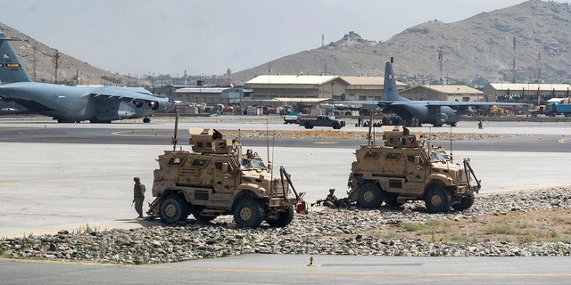 U.S. Army soldiers assigned to the 82nd Airborne Division patrol Hamid Karzai International Airport in Kabul, Afghanistan Aug. 17, 2021. (U.S. Air Force/Senior Airman Taylor Crul/Handout via REUTERS)