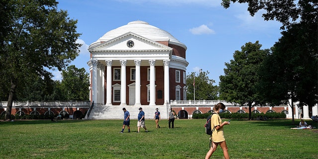 Students walk across The Lawn as in-person classes are underway at the University of Virginia on Tuesday, Sept.  8, 2020. 