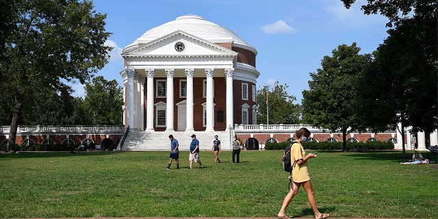 Students walk across The Lawn as in-person classes are underway at the University of Virginia on Tuesday, Sept. 8, 2020.