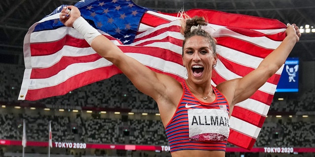 Valarie Allman, of the United States, poses after winning the gold medal in the women's discus throw final at the 2020 Summer Olympics, Monday, Aug. 2, 2021, in Tokyo. (AP Photo/David J. Phillip)