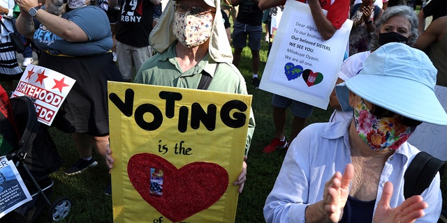 WASHINGTON, DC - AUGUST 28:  Voting rights activists participate in a pre-march rally during a March On For Voting Rights event at McPherson Square August 28, 2021 in Washington, DC. Activists gathered in Washington to mark the 58th anniversary of the 1963 March On Washington, where Dr. Martin Luther King delivered his "I Have a Dream" speech, and urged the Senate to pass voting rights legislations.  (Photo by Alex Wong/Getty Images)