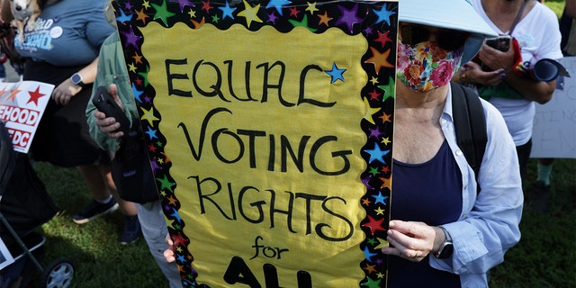 WASHINGTON, DC - AUGUST 28:  Voting rights activists participate in a pre-march rally during a March On For Voting Rights event at McPherson Square August 28, 2021 in Washington, DC. Activists gathered in Washington to mark the 58th anniversary of the 1963 March On Washington, where Dr. Martin Luther King delivered his "I Have a Dream" speech, and urged the Senate to pass voting rights legislations.  (Photo by Alex Wong/Getty Images)