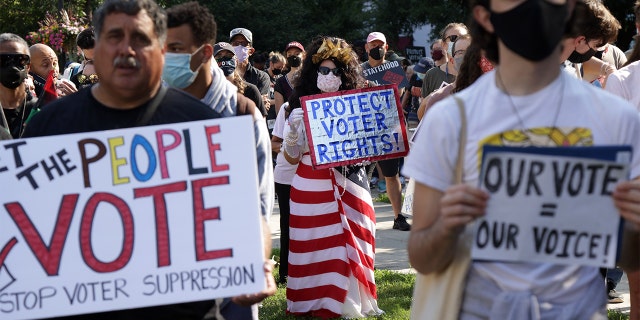 WASHINGTON, DC - AUGUST 28: Voting rights activist Regina Cosio of Syracuse, New York, dresses as "Ms. Liberty" as she participates in a pre-march rally during a March On For Voting Rights event at McPherson Square August 28, 2021 in Washington, DC. Activists gathered in Washington to mark the 58th anniversary of the 1963 March On Washington, where Dr. Martin Luther King delivered his "I Have a Dream" speech, and urged the Senate to pass voting rights legislations. (Photo by Alex Wong/Getty Images)
