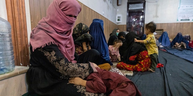 Displaced Afghan women and children from Kunduz are seen at a mosque that is sheltering them Aug. 13, 2021, in Kabul, Afghanistan. 