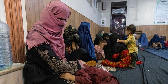 Displaced Afghan women and children from Kunduz are seen at a mosque that is sheltering them Aug. 13, 2021, in Kabul, Afghanistan. 