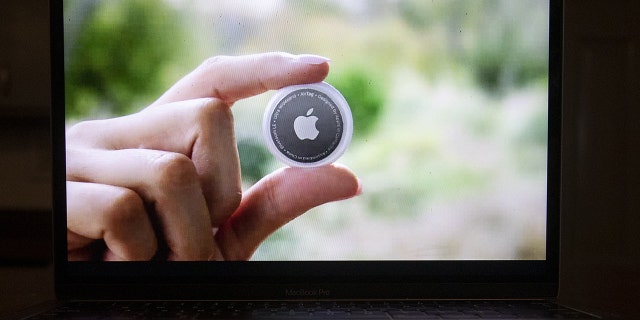 An Apple AirTag device during the Spring Loaded virtual product launch in Tiskilwa, Illinois, U.S., on Tuesday, April 20, 2021. 