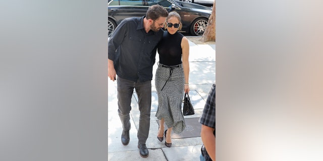 Well-dressed duo Ben Affleck and Jennifer Lopez wear matching outfits as they go shopping together at the Westfield mall in Los Angeles.