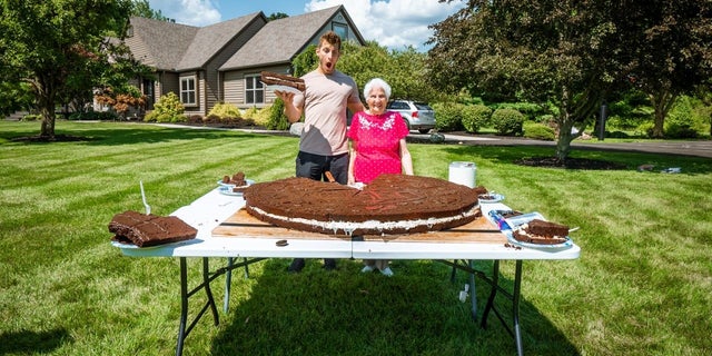 Ross Smith and his 95-year-old grandmother are proud of their 180-pound Oreo and are confident that they broke a Guinness World Record for the largest cream-filled biscuit.