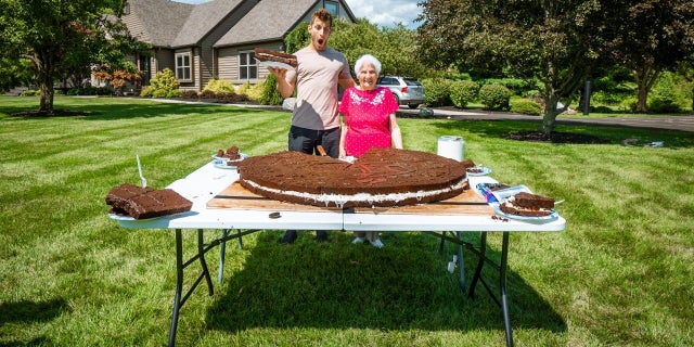 Ross Smith and his 95-year-old grandmother are proud of their 180-pound Oreo and are confident that they broke a Guinness World Record for the largest cream-filled biscuit.