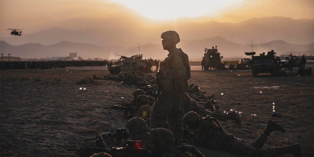 U.S. Army Soldiers assigned to the 10th Mountain Division stand security at Hamid Karzai International Airport, in Kabul, Afghanistan, Monday, Aug. 16, 2021. (Sgt. Isaiah Campbell/U.S. Marine Corps via AP)