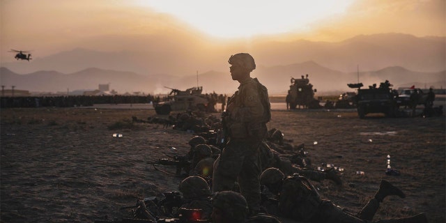 U.S. Army Soldiers assigned to the 10th Mountain Division stand security at Hamid Karzai International Airport, in Kabul, Afghanistan, Monday, Aug. 16, 2021. (Sgt. Isaiah Campbell/U.S. Marine Corps via AP)